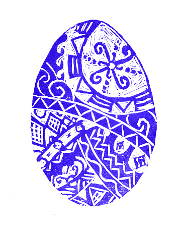 Easter egg filled with ornament. Blue color. Isolated on white background. Geometric ornaments in ethnic style. Linocut. Printmaking style. Ukrainian traditions. Decor.