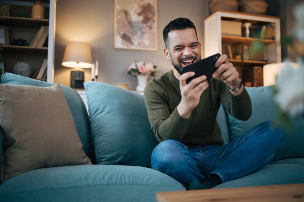 istock A man plays games on a smartphone. 2075115673