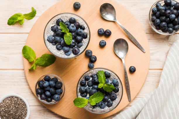 istock Healthy breakfast or morning with chia seeds vanilla pudding and blueberry berries on table background, vegetarian food, diet and health concept. Chia pudding with coconut milk and blueberry 2075135892