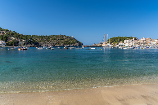 Beautiful view of the Port de Soller coastline. Harbor with many yachts and ships. Mallorca island, Spain, Mediterranean Sea. Balearic Islands