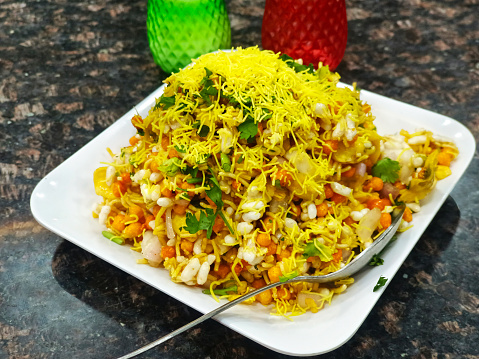 Tasty Bhelpuri is a savoury snack or chaat. It is made out of puffed rice, vegetables and a tangy tamarind sauce.