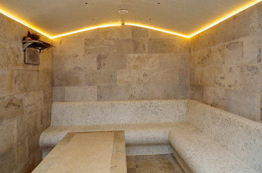 Unique hammam design made of light stone. Traditions and rituals, care and renewal of body and soul.