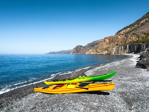 Two kayaks on the shore of Domata beach in Crete, Greece
