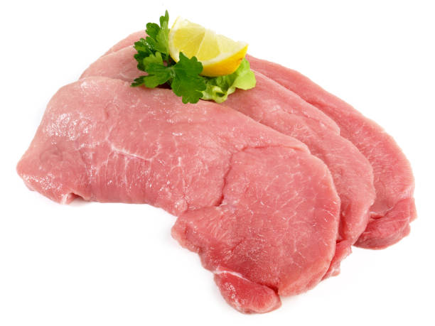 pork leg - meat slices - isolated - schweineschnitzel - fotografias e filmes do acervo