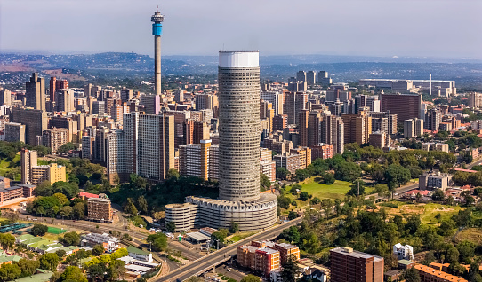 Hillbrow with Ponte City apartments and the communications tower in Johannesburg with the urban residential district.