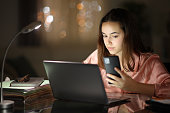 Tele worker working in the night using several devices