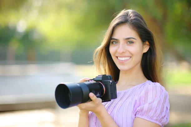 istock Happy photographer posing looking at camera 2075229116