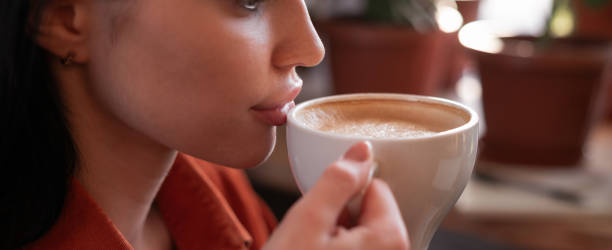 istock Attractive beautiful woman drinking coffee in cafe, relaxing, have Coffee Break. Drinks and leisure concept 2075247091