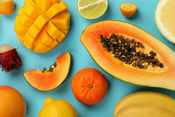 istock Exotic fruits set on blue background, top view 2075247119