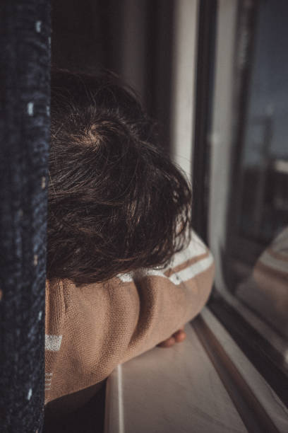 istock Solitary Contemplation by the Window 2075263723