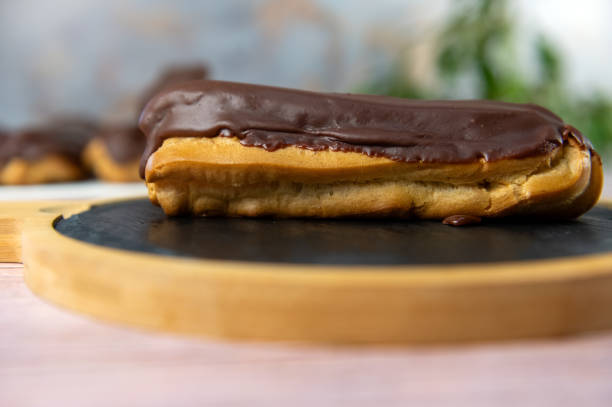 istock French ecler with chocolate. Traditional french dessert eclair. 2075269649