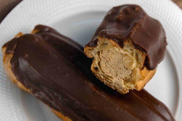 istock French ecler with chocolate. Traditional french dessert eclair. 2075280444