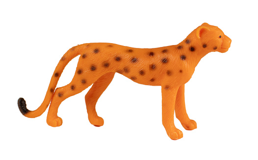 Plastic leopard toy, isolated on white background.
