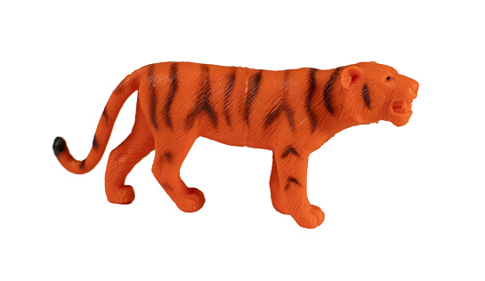 Plastic tiger toy, isolated on white background.