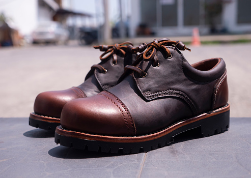 Men fashion brown shoes leather on the floor.