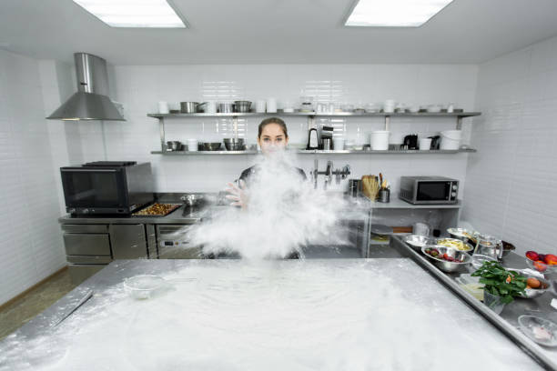 istock Pastry chef claps his hands and the flour is scattered all over the kitchen 2075321171