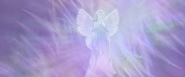 istock Praying Angel on a wispy pale lilac feathered background 2075333091