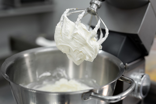 Cream or meringue on the Corolla of the kitchen machine, mixer.