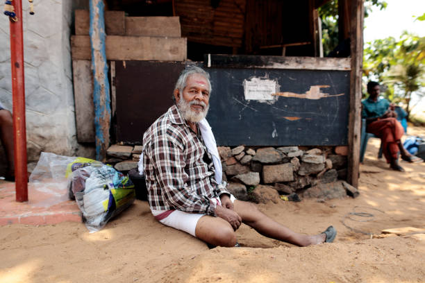 Varkala, Kerala, India - February 24, 2024: Hindu holy man on religious ceremony Puja on the Varkala beach