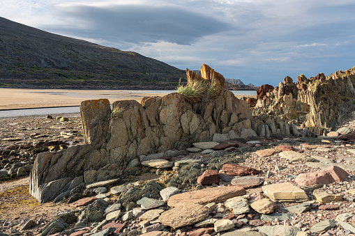 Rock formations by the Barents Sea on a beautiful summer evening, Vesterelva, Vardø, Finnmark