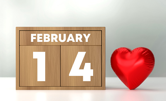 February 14 And Valentines Day. Wooden Calendar And Heart Shaped Balloon