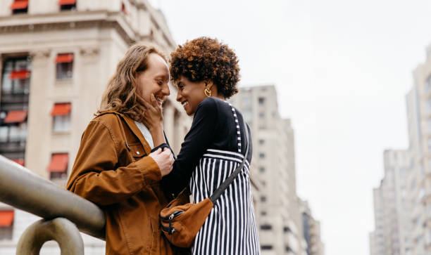 istock Affectionate embrace on city streets, love and connection urban backdrop 2075384995
