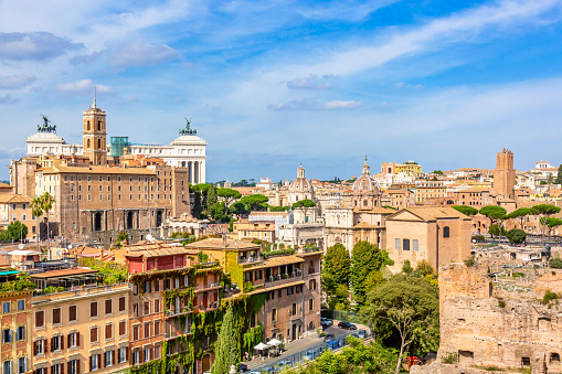 Panoramic cityscape view of the Roman Forum and Roman Altar of the Fatherland in Rome, Italy. World famous landmarks in Italy during summer sunny day.