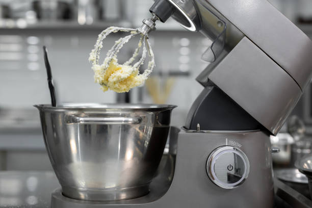 istock Butter with sugar on the Corolla of the kitchen machine, mixer 2075395574