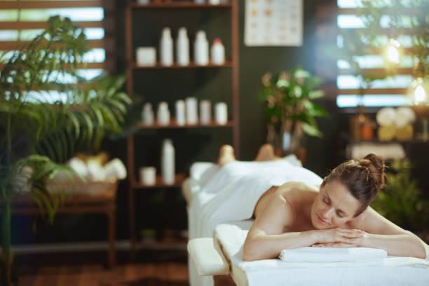 istock relaxed modern woman in spa salon laying on massage table 2075398814