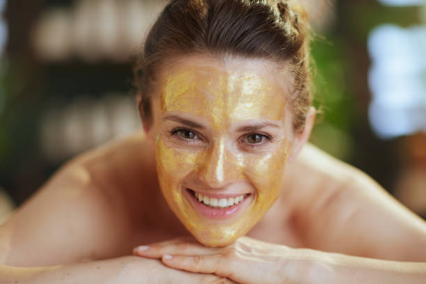 istock smiling woman in massage cabinet laying on massage table 2075398821