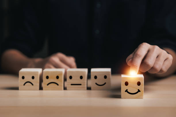 istock Customer service evaluation concept. Businessman pressing face smile emoticon show on virtual screen at smartphone. Customer services best excellent business rating experience. 2075402027
