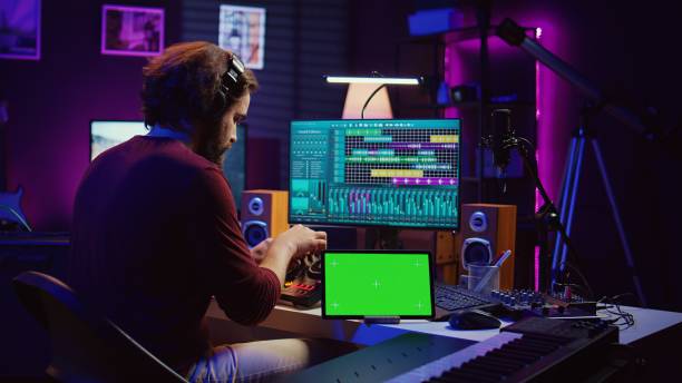 istock Musician mixing and mastering sounds at home studio with electronic console 2075403112