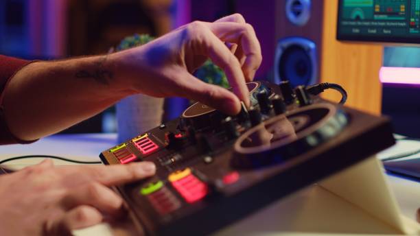 istock Artist editing sounds on mixing console in home studio 2075408963