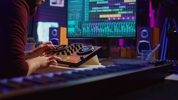 istock Sound engineer mixing and mastering sounds with electronic audio console 2075413325