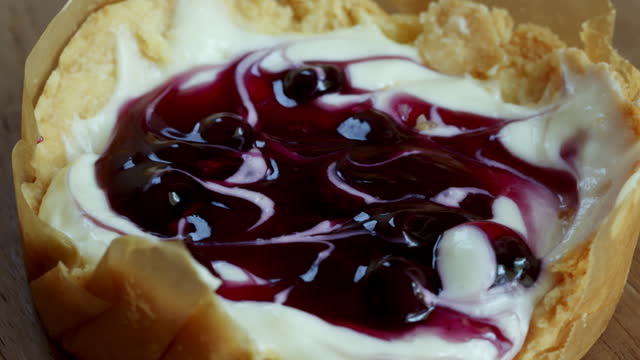 Cheesecake topping with black currant and blueberry sauce.