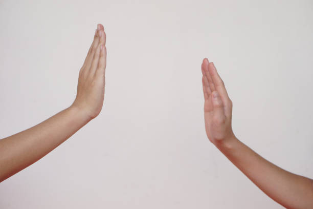 African man hands with a protection gesture isolated on a white background
