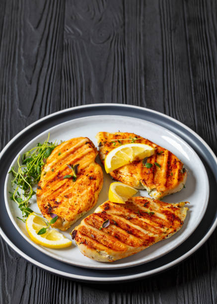 istock juicy grilled chicken cutlets on plate, top view 2075448078
