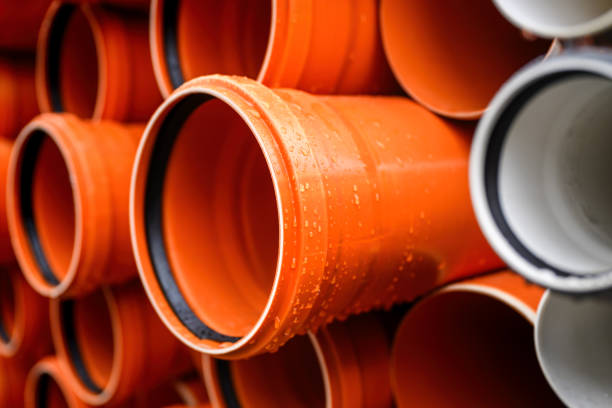 istock Plastic water pipes stacked outdoor on rainy day 2075449138