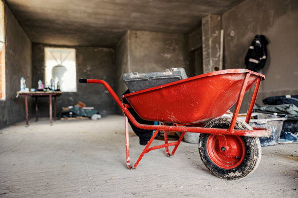 istock A red wheelbarrow in a house in building process. 2075450754