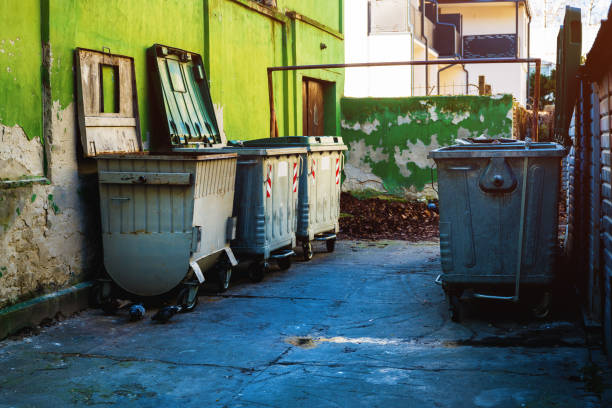 istock Trash container dumpsters in dirty alley 2075451827