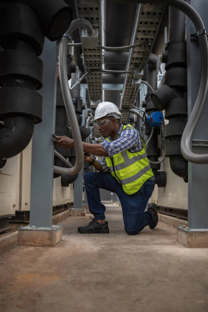 istock Industrial engineer check the air conditioning cooling system on site. engineer visit and inspection site engineer at industrial site. Inspector engineer check and working on site 2075454384