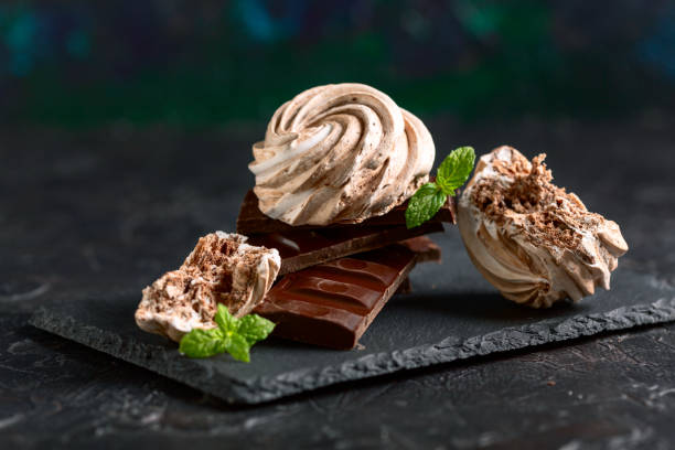 istock Meringues with dark chocolate. 2075454421
