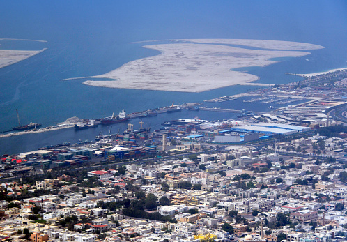 Al Waheda, Deira district, Dubai: Al Hamriya Port, Harbor operated by Dubai Ports World. Mainly dedicated to commerce with South Asia and East Africa. Food, automobile spare parts, and livestock comprise the bulk of trade through the port. In the background lies Al Mamzar Island and in the foreground the Al Waheda residential area.