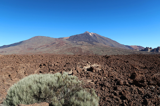Tenerife, Canary Islands, Spain, February 23, 2024.  Mount Teide National Park. Distant view of the summit. Volcanic landscape and geology. Outdoors on a sunny winter day