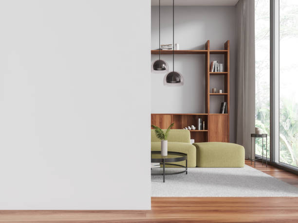 istock White living room interior with green couch and blank wall 2075473947