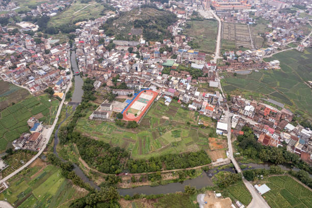 A bird's-eye view of rural fields and buildings