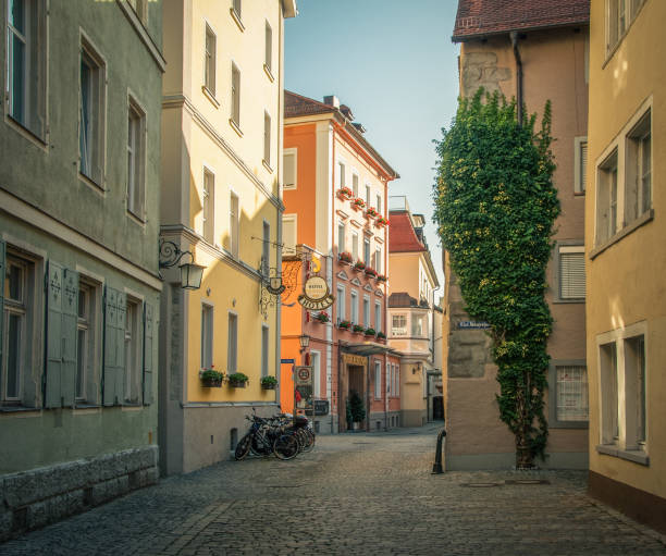 Lindau, Germany - August 02 2013: Narrow cobbled streets in the centher of small medieval town. Empty street in Lindau Altstadt on sunny afternoon.