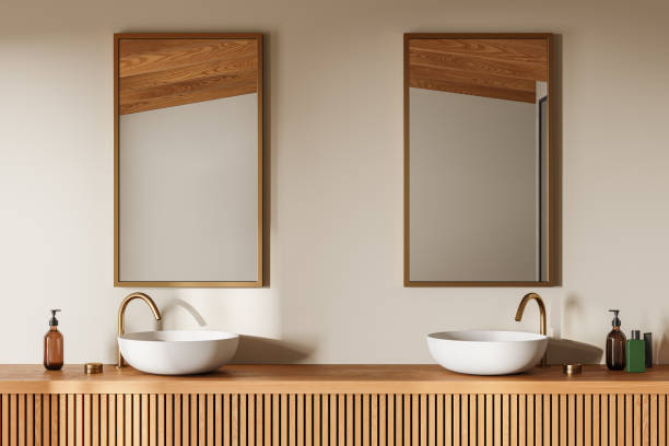 istock Beige stylish hotel bathroom interior with double sink, mirror and accessories 2075484941