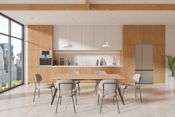 istock Stylish home kitchen interior with eating table and cabinet, panoramic window 2075498217