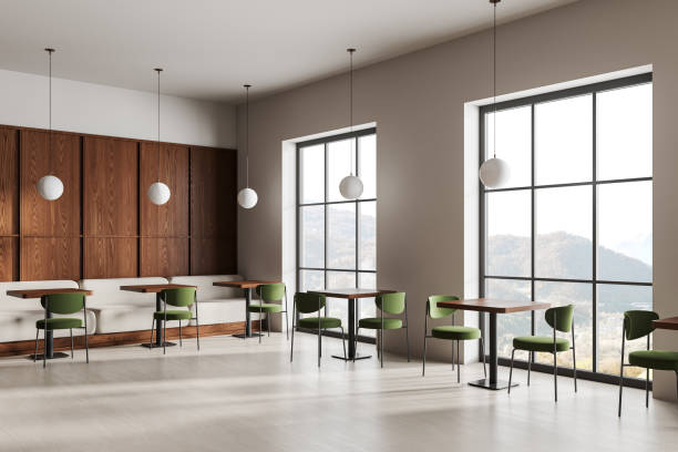 istock Beige restaurant interior with chairs and table in row, dining space near window 2075501436